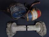 two old fire hydrants on a table with a brush