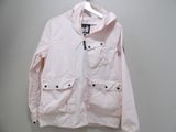 pink jacket hanging on a hanger against a white wall