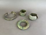 several pieces of metal are sitting on a table