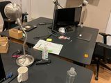 a desk with a laptop and a monitor on it