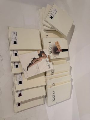 a lot of books that are stacked on top of each other