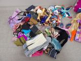 a pile of clothes and other items on the floor