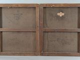an old wooden box with a cross on the inside and a cross on the outside