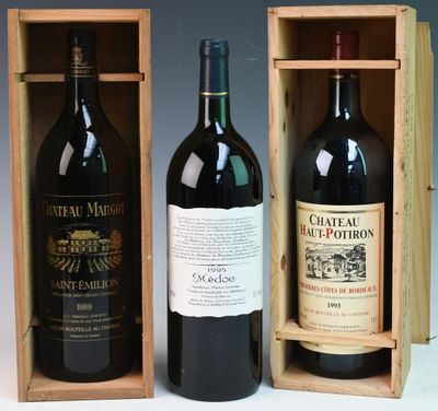 two bottles of red wine in a wooden box on a table