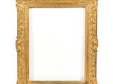 an antique gold frame with a white background