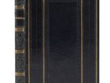 a black book with gold trim and a gold border