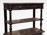 an old wooden shelf with three shelves on top of it