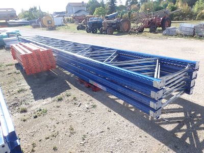 an image of a large blue metal structure in a parking lot