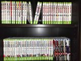 a book shelf with a lot of dvds on it