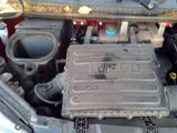 a picture of a car engine with its hood open