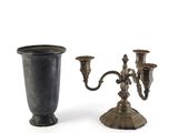 pair of antique brass candelabs on stands on a white background