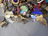 a pile of assorted metal items on the floor