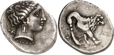 a silver coin with a woman ' s head and a man ' s head on it