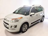 a picture of a small white car parked in a white room