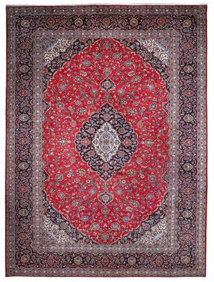 a red and black rug with a medallion design