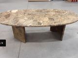 a marble table with a wooden base in a store