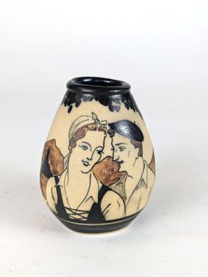 a vase with a picture of two people on it