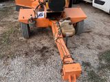 a small machine that is sitting in the dirt