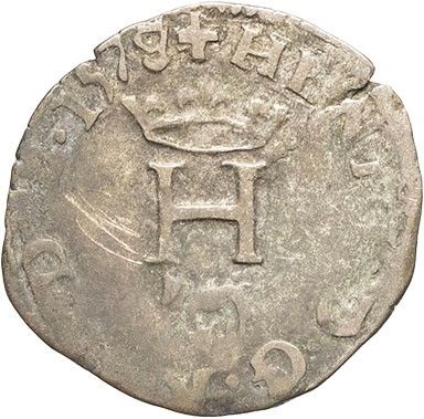 a close up of a coin with a crown on it