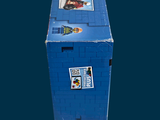 a blue box with stickers on it sitting on a table