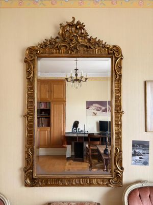 a mirror hanging on the wall in a living room
