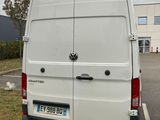 a white van that is parked in a parking lot