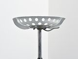 an image of a metal stool with a bowl on it