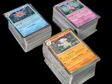 a close up of a pile of cards on a black background