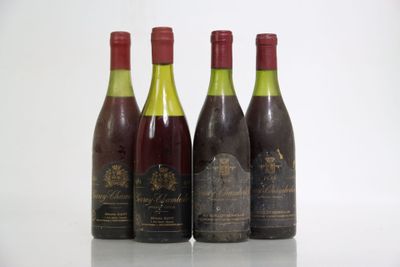 three bottles of wine are lined up on a table