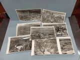 several old black and white photos of a city and mountains