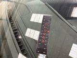 a ruler on the windshield of a car that is parked in a garage