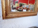 a mirror hanging on the wall in a room
