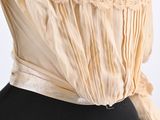 a close up of a woman ' s blouse on a mannequin mannequin mannequin mannequin mannequin mannequin mannequin