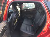 a red car with black seats in the back of it