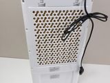 a close up of a white computer case with a cord attached to it