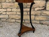 a wooden table with a black metal frame on it