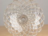 a clear glass bowl sitting on a wooden table