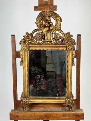 a mirror on a stand with a mirror on it