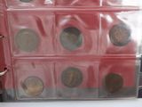 a clear bag with coins inside of it on a table