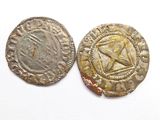 two silver coins with a star on one side and a star on the other