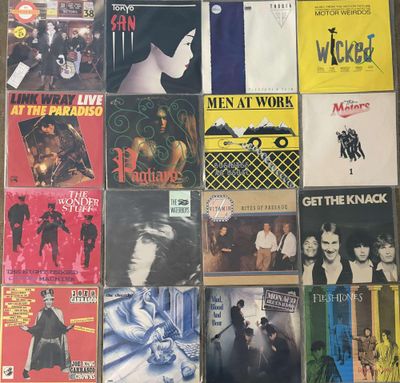 a lot of different album covers on the wall