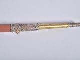 a pen that is laying on a white surface