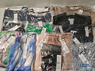 many different types of clothing on the table