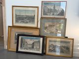four framed pictures on the floor of a room