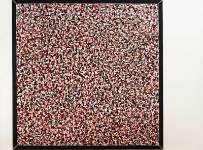a black frame with a red, white and black painting on it