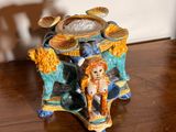 a figurine of a dog and a cat on a table