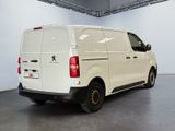 the white van is parked in the garage of the building