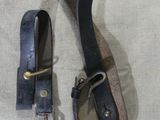 a pair of scissors and a leather strap on a table