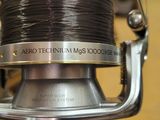 a person holding a reel in their hand in a store
