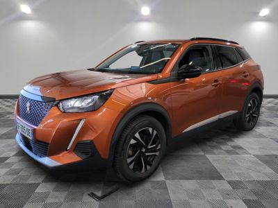 a orange suv parked in a room with a checkered floor